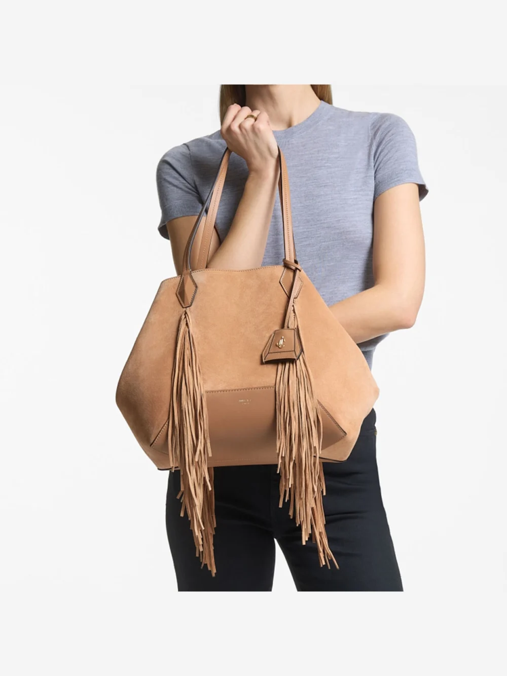 Side view of the Jimmy Choo Diamond Tote Medium Toffee Suede Tote Bag with Fringes
