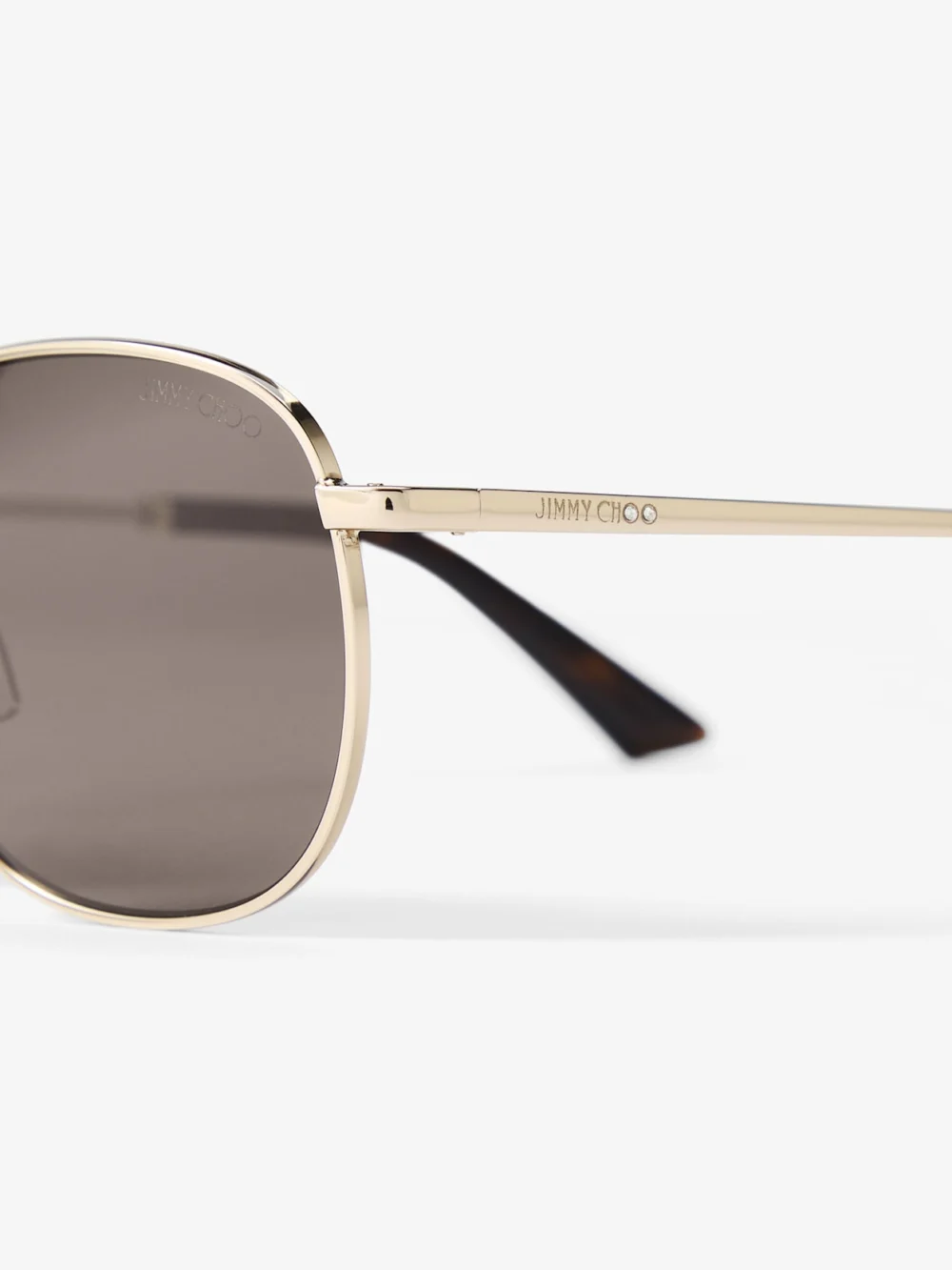 Close-up detail of the Jimmy Choo Dune Pale Gold and Dark Brown Pantos Metal Sunglasses