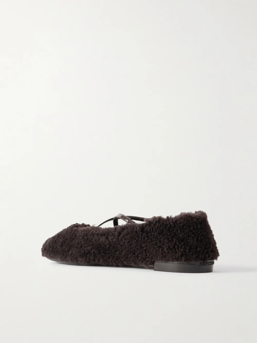 Back view of the Jimmy Choo Eleri Embellished Patent Leather-trimmed Shearling Ballet Flats