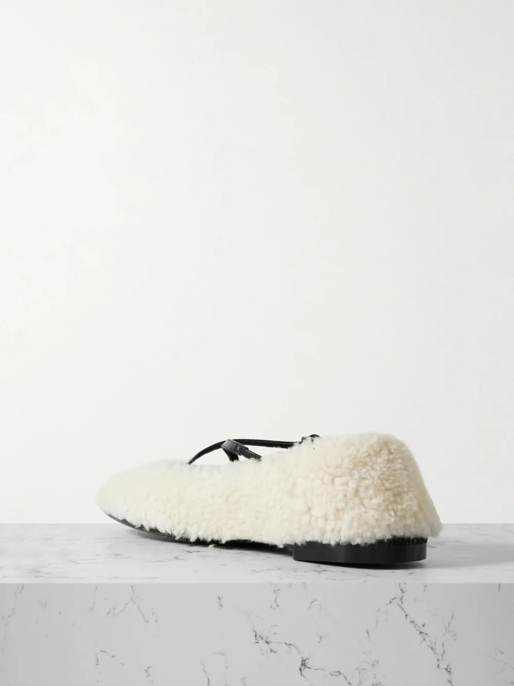 Back view of the Jimmy Choo Eleri Embellished Patent Leather-trimmed Shearling Ballet Flats