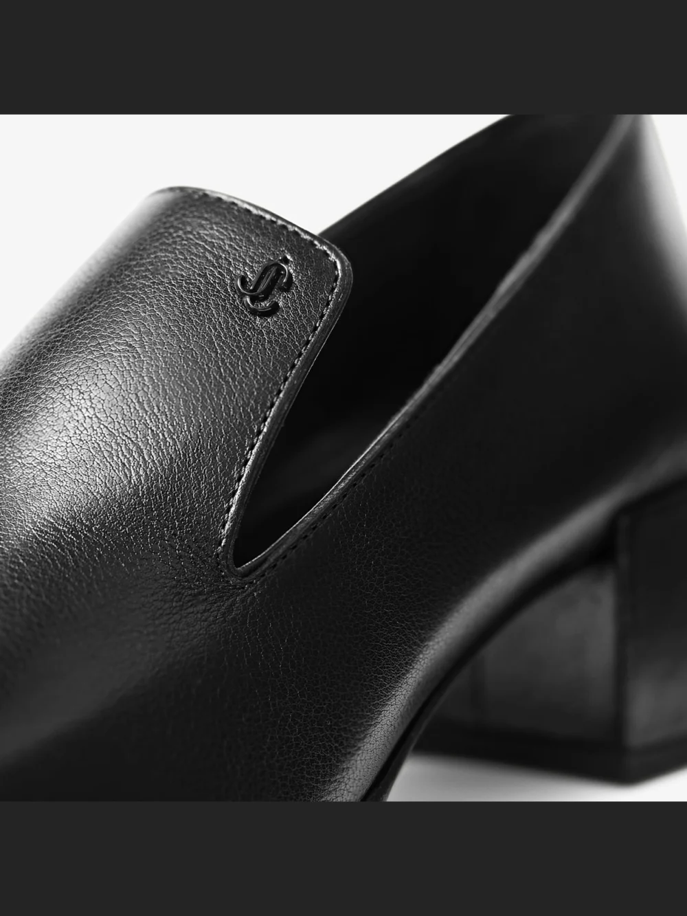 Close-up detail of the Jimmy Choo Eliot Slipper 45 Black Vintage Leather Slippers