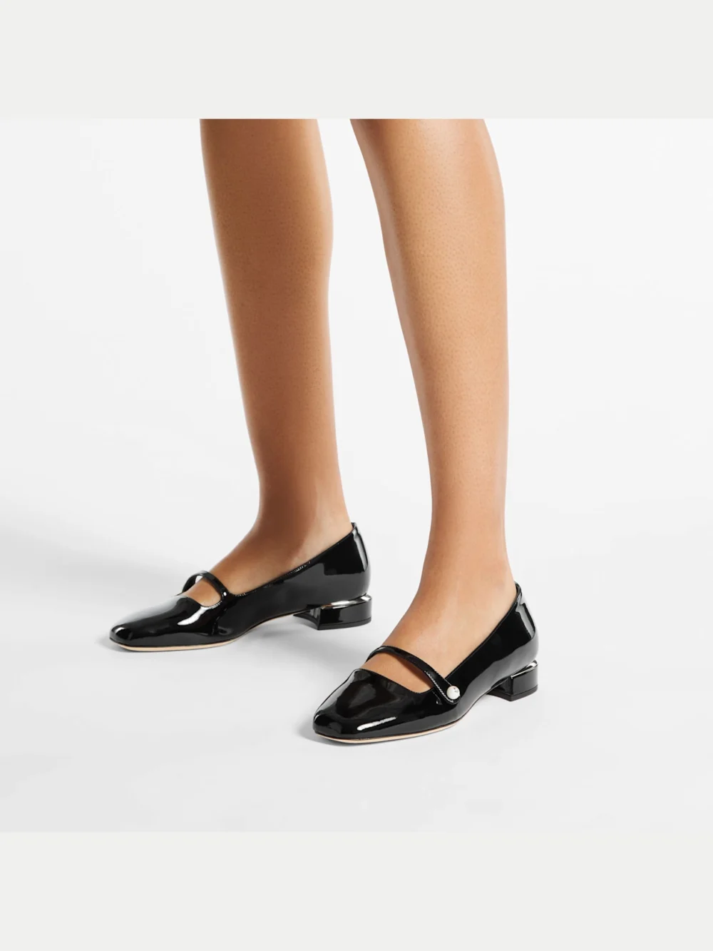 Side view of the Jimmy Choo Elisa Ballerina Black Patent Leather Ballerina Pumps