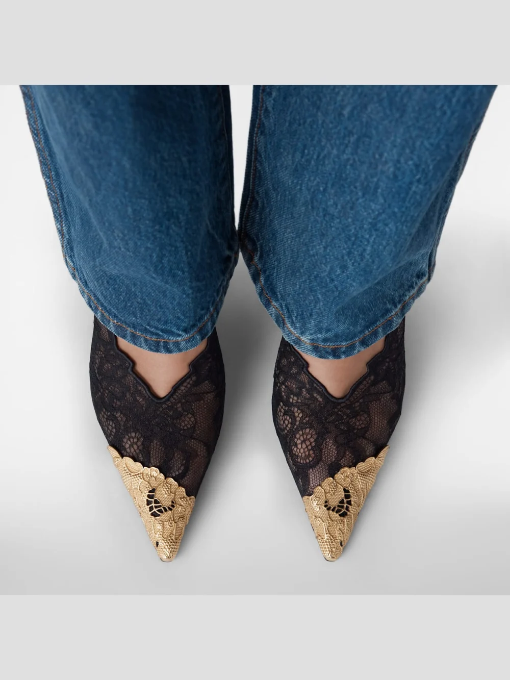 Close-up detail of the Jimmy Choo Faiz 100 Black Jimmy Choo Lace Pumps with Metal Lace Detail