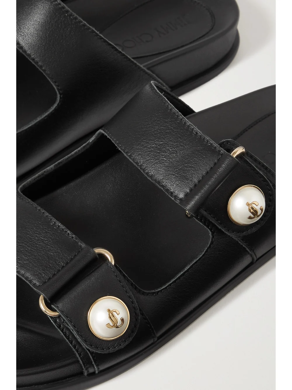 Close-up detail of the Jimmy Choo Fayence Embellished Leather Slides