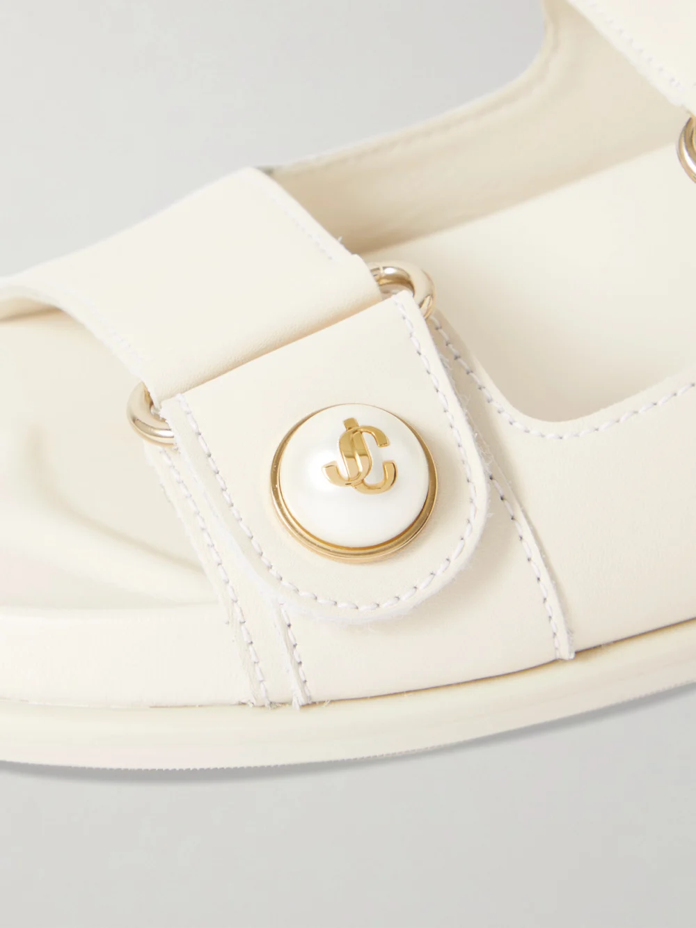 Close-up detail of the Jimmy Choo Fayence Embellished Leather Slides