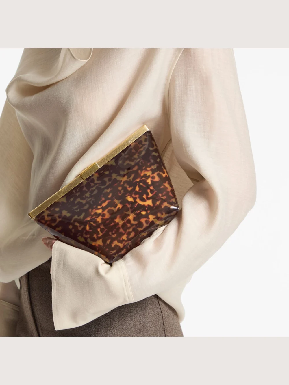 Side view of the Jimmy Choo Ganache Transparent Tortoiseshell Clutch Bag