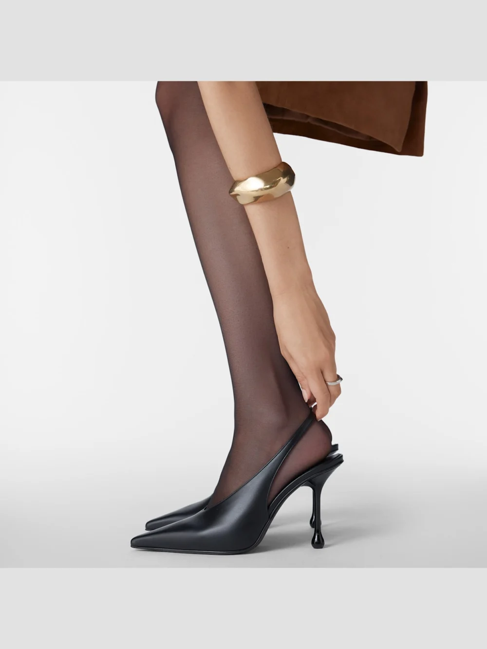 Side view of the Jimmy Choo Isa 95 Black Leather Pumps