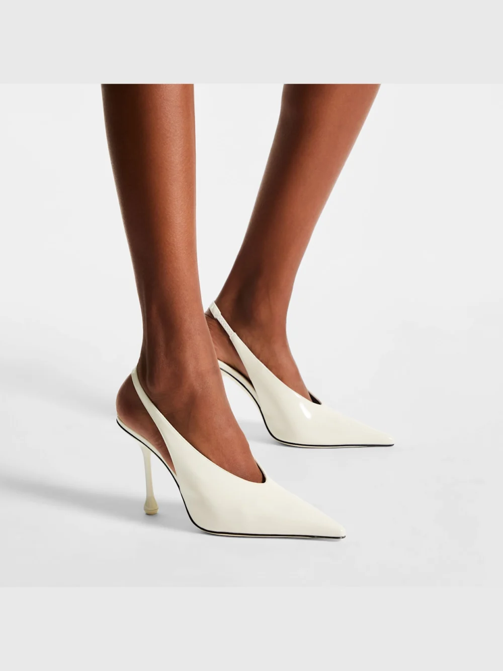 Side view of the Jimmy Choo Isa 95 Latte Patent Leather Pumps
