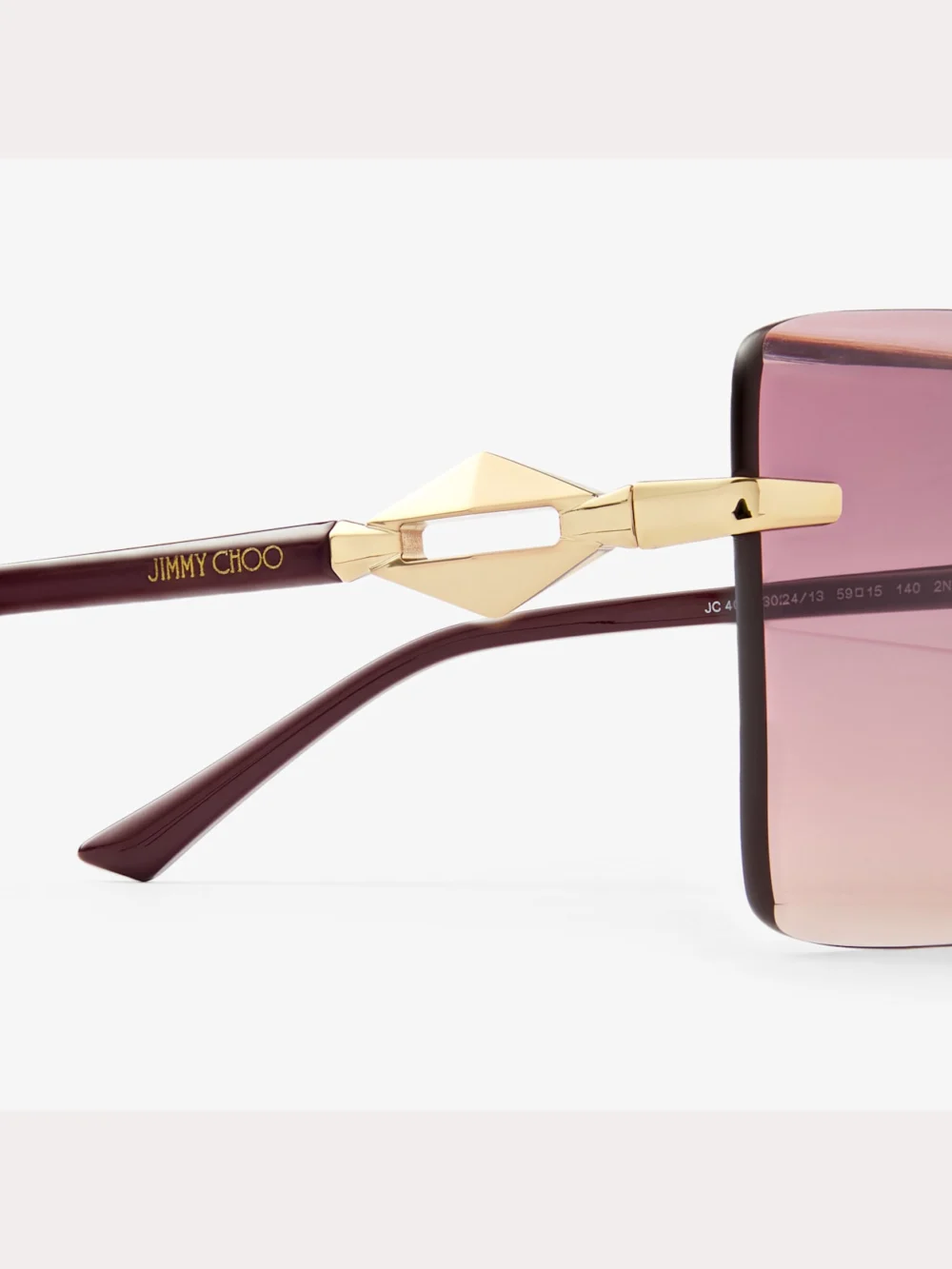 Close-up detail of the Jimmy Choo Isaline Gold Cranberry Square Sunglasses