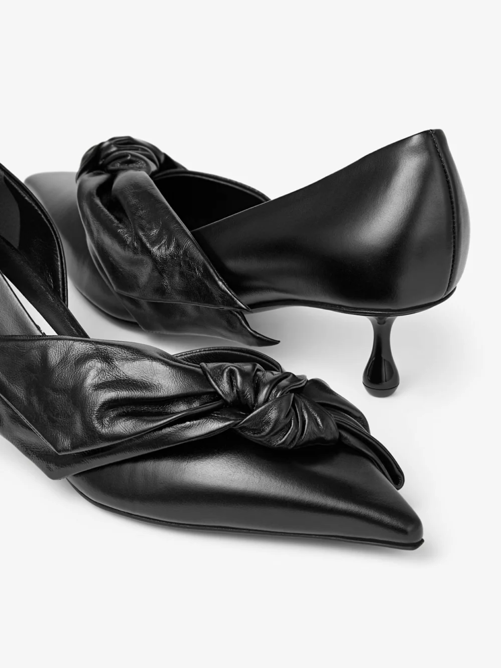 Back view of the Jimmy Choo Issy Pump 50 Black Leather Pumps with Oversized Bow