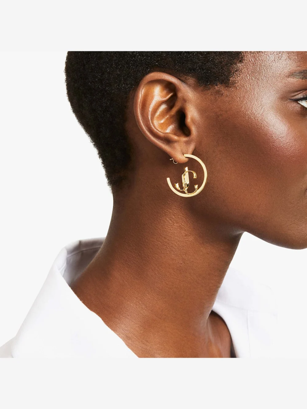 Side view of the Jimmy Choo Jc Monogram Hoops Gold Finish Metal Jc Monogram Hoops
