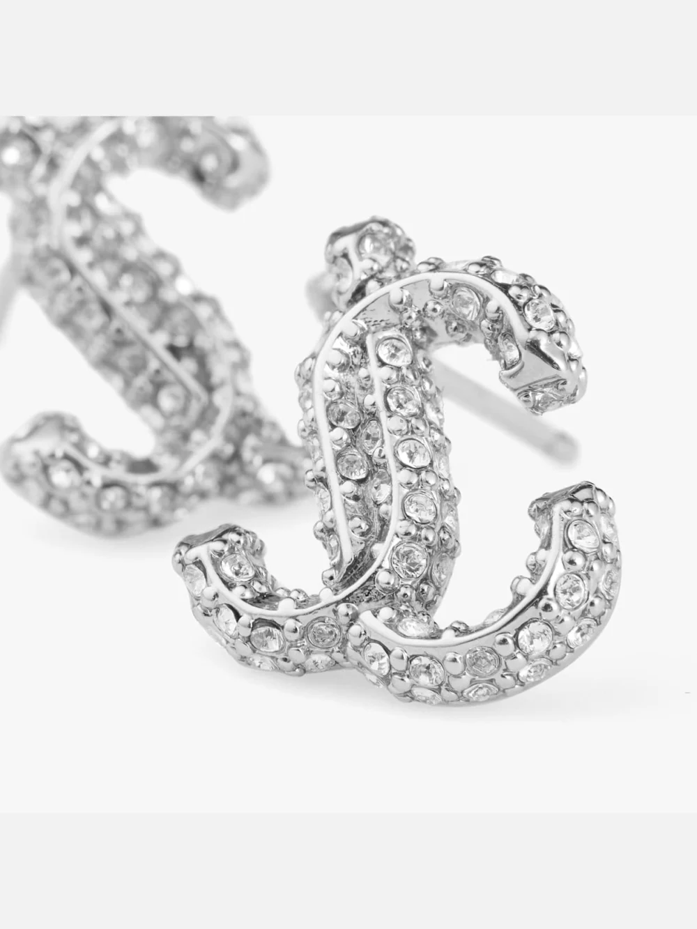 Close-up detail of the Jimmy Choo Jc Studs Silver Finish Metal Jc Stud Earrings with Swarovski Crystals