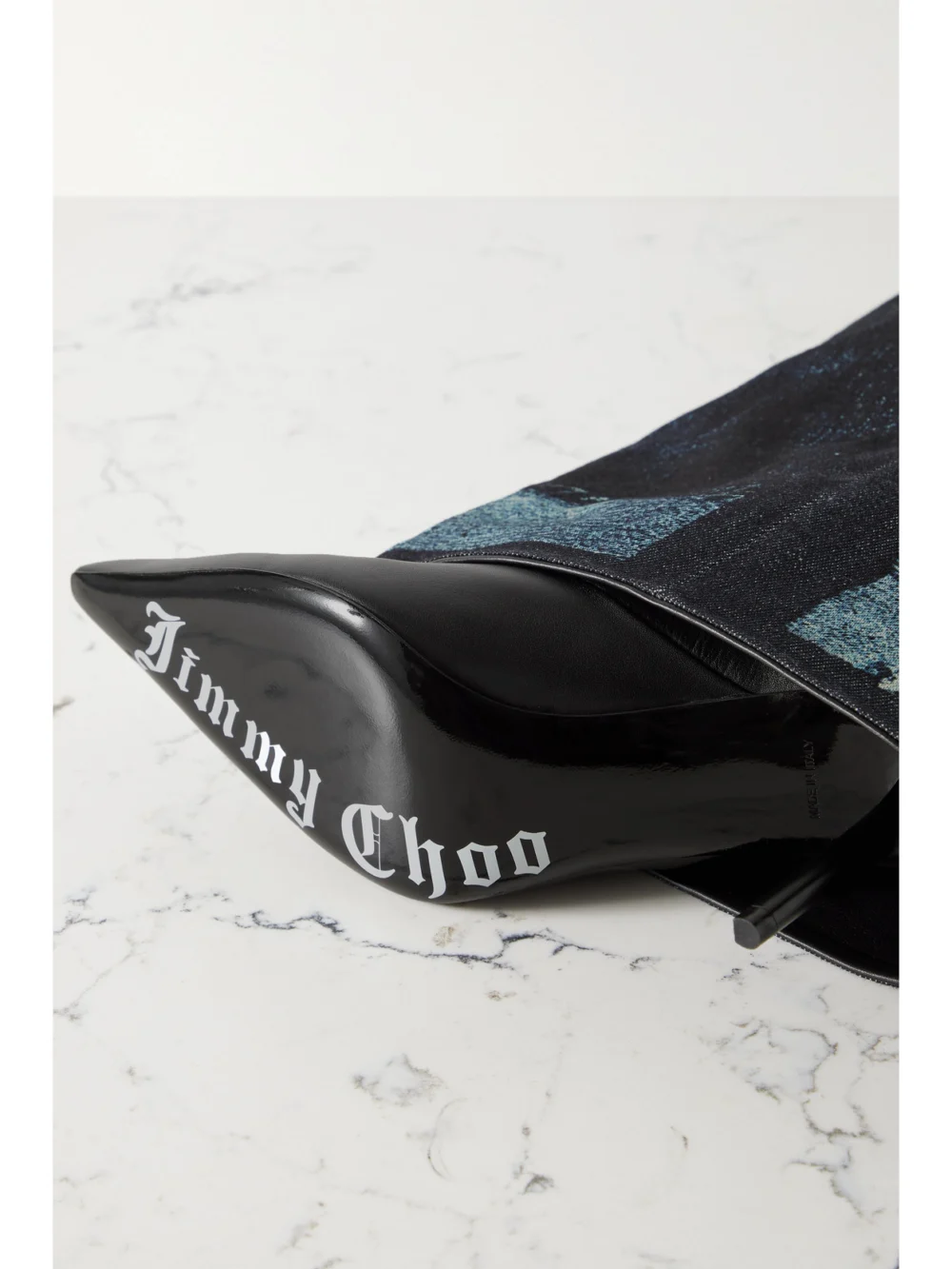 Close-up detail of the Jimmy Choo + Jean Paul Gaultier 90 Printed Denim and Leather Over-the-knee Boots