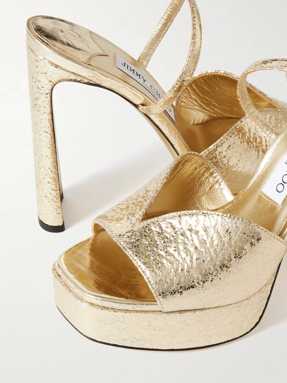 Close-up detail of the Jimmy Choo Karli 125 Metallic Textured-leather Platform Sandals