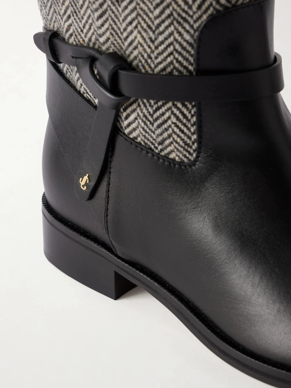 Close-up detail of the Jimmy Choo Lawton Leather-trimmed Herringbone Knee Boots