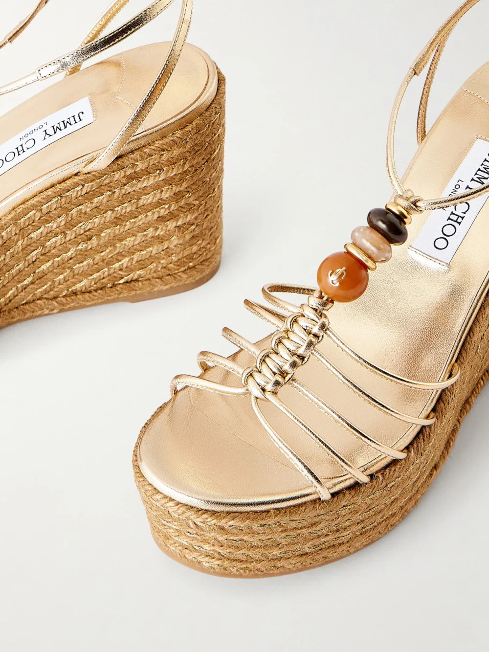 Close-up detail of the Jimmy Choo Lemi 100 Embellished Metallic-leather Platform Wedge Sandals