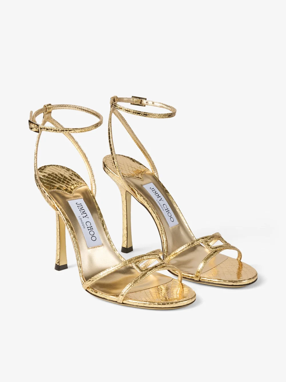 Close-up detail of the Jimmy Choo Leo 100 Gold Candy Wrap Leather Sandal