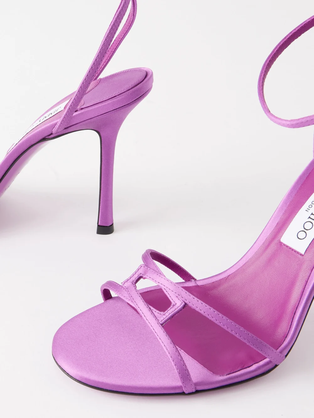 Close-up detail of the Jimmy Choo Leo 100 Satin Sandals