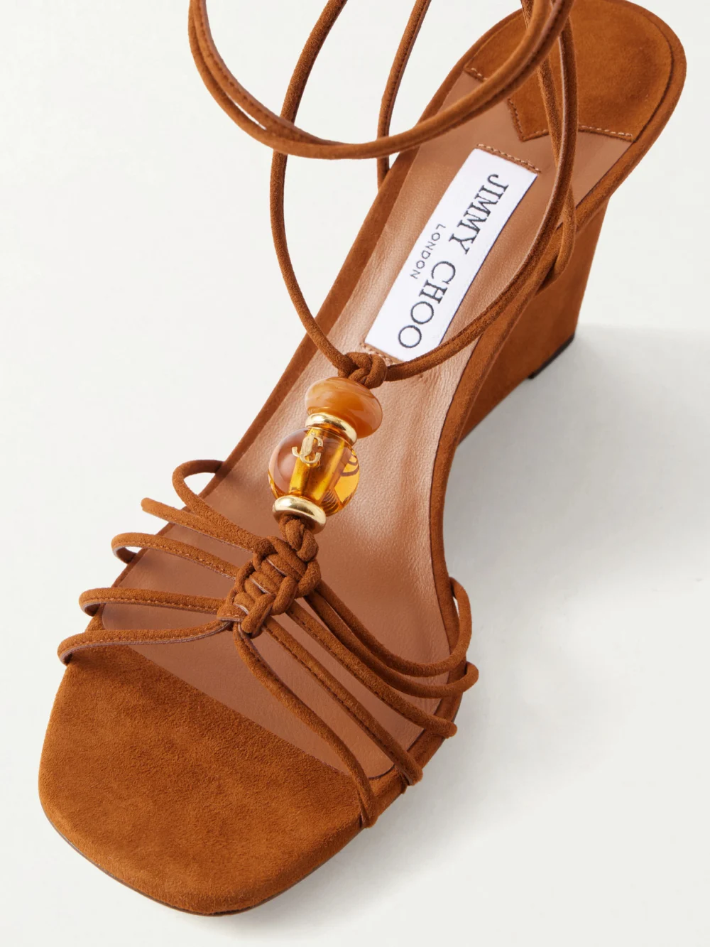 Close-up detail of the Jimmy Choo Lova 85 Embellished Suede Wedge Sandals