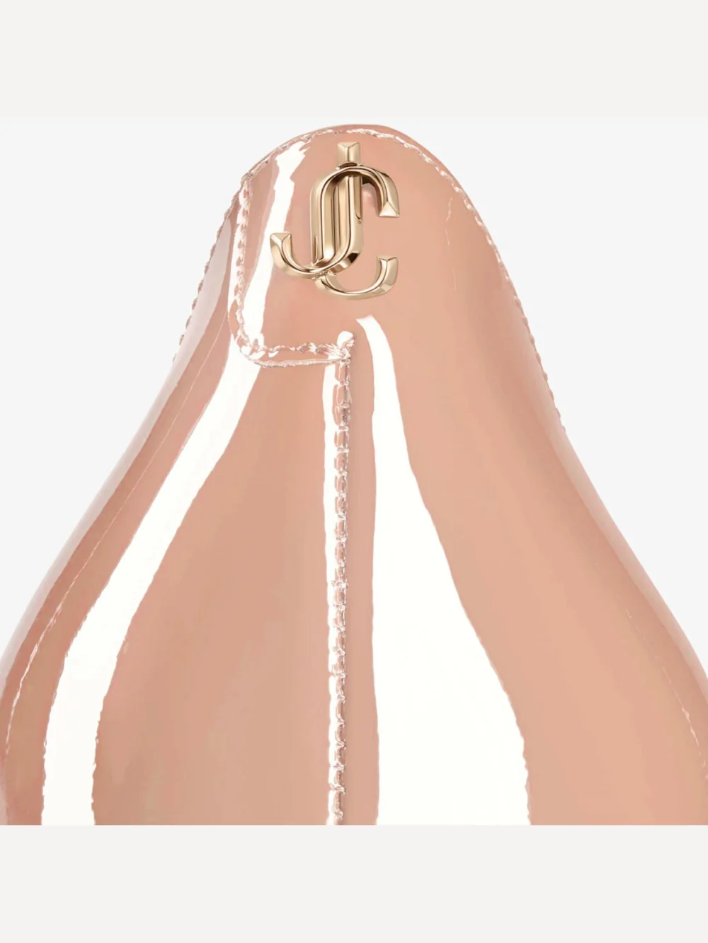 Close-up detail of the Jimmy Choo Love 85 Ballet Pink Patent Leather Pointy Toe Pumpss with Jc Emblem
