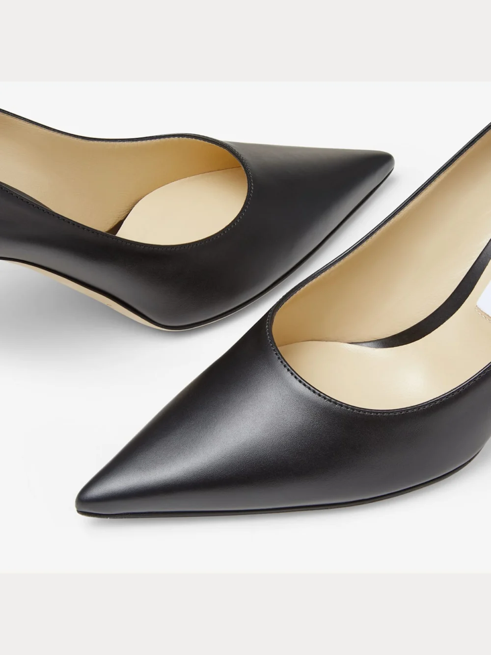Close-up detail of the Jimmy Choo Love 85 Black Calf Leather Pumps with Jc Emblem