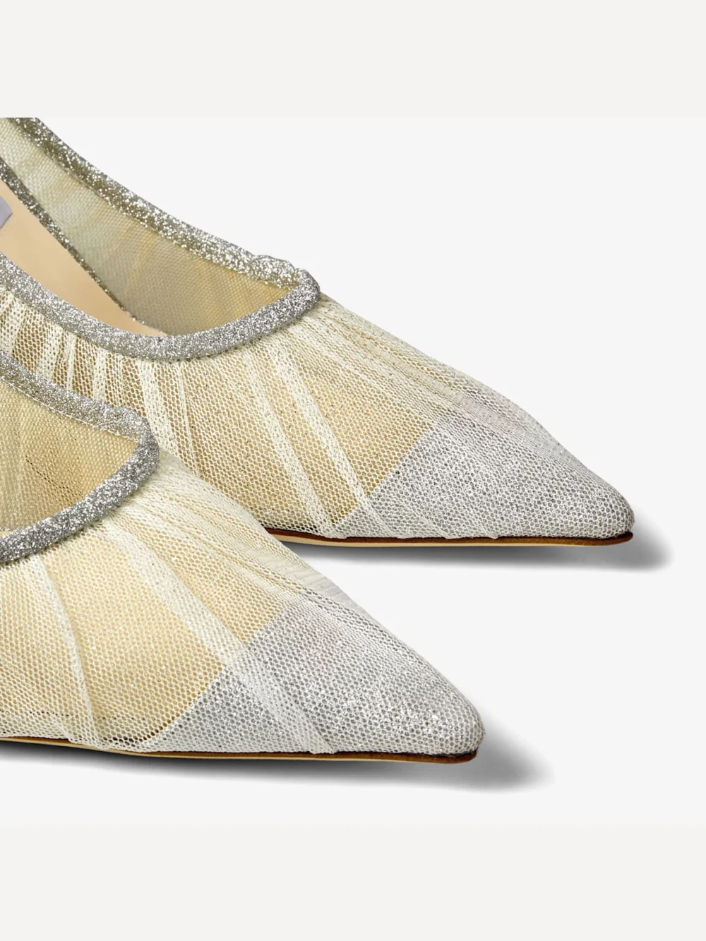 Close-up detail of the Jimmy Choo Love 85 Metallic Silver Glitter Fabric Pumps with Ivory Tulle Overlay