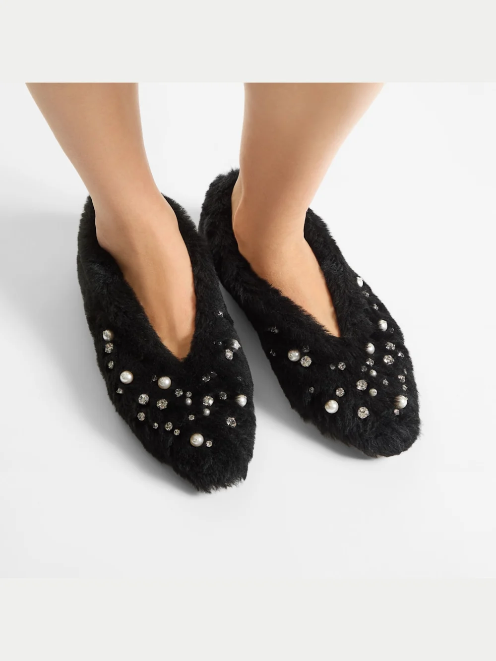 Side view of the Jimmy Choo Margot Flat Black Shearling Flats with Embroidered Pearls and Crystals