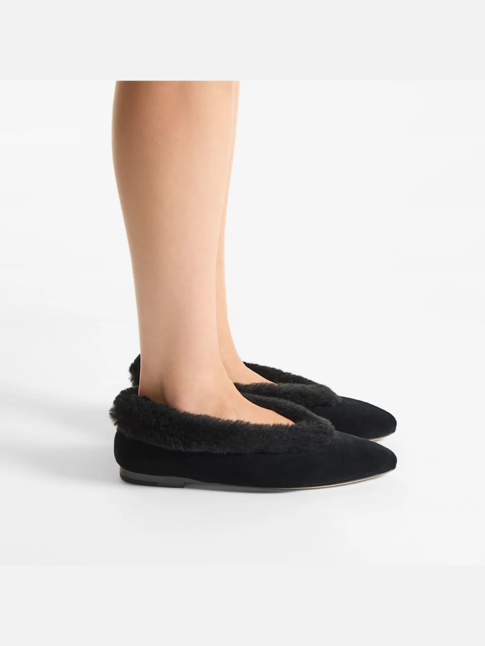 Side view of the Jimmy Choo Margot Flat Black Suede Flats with Shearling Lining