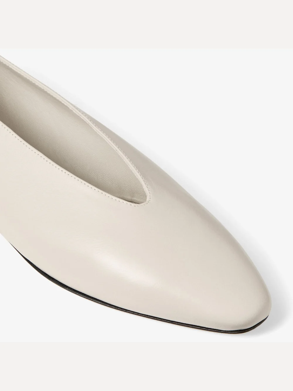 Back view of the Jimmy Choo Margot Flat Bone Soft Shiny Biker Leather Flats