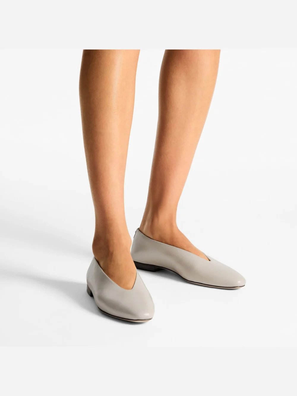 Side view of the Jimmy Choo Margot Flat Bone Soft Shiny Biker Leather Flats