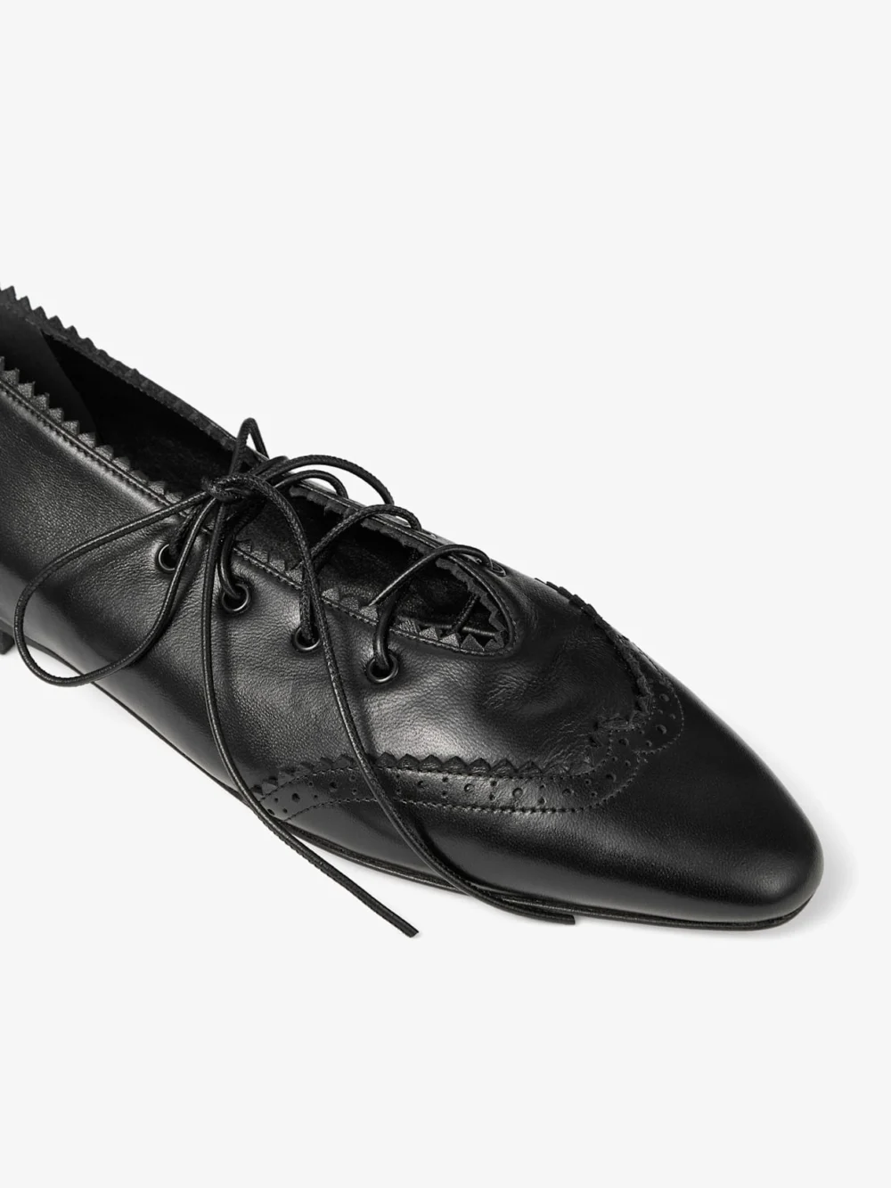 Back view of the Jimmy Choo Margot Lace Up Flat Black Leather Lace Up Flats with Brogue Detailing