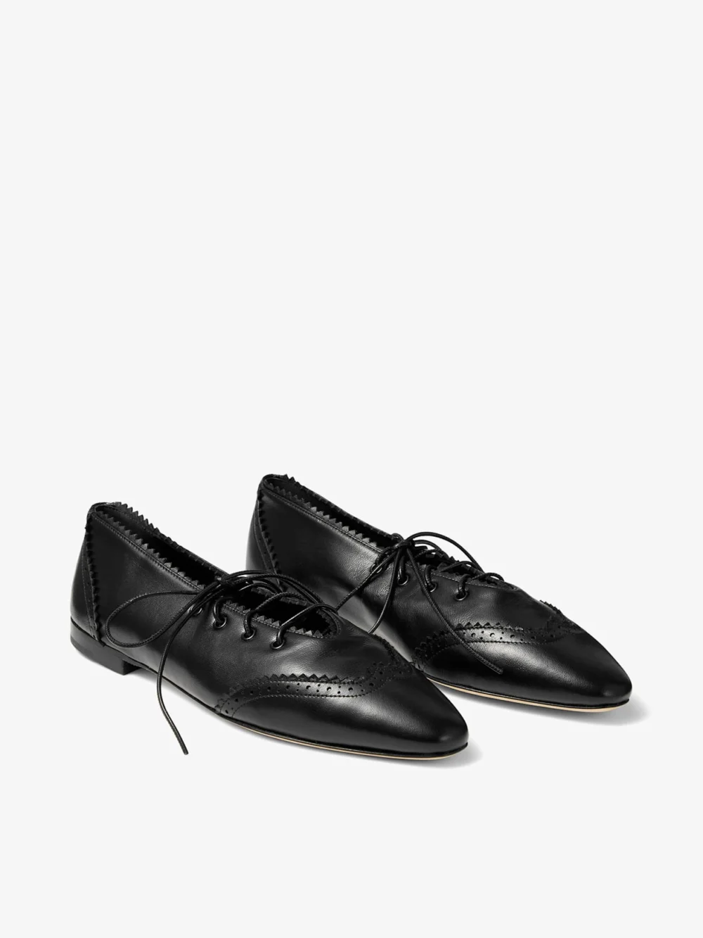 Close-up detail of the Jimmy Choo Margot Lace Up Flat Black Leather Lace Up Flats with Brogue Detailing