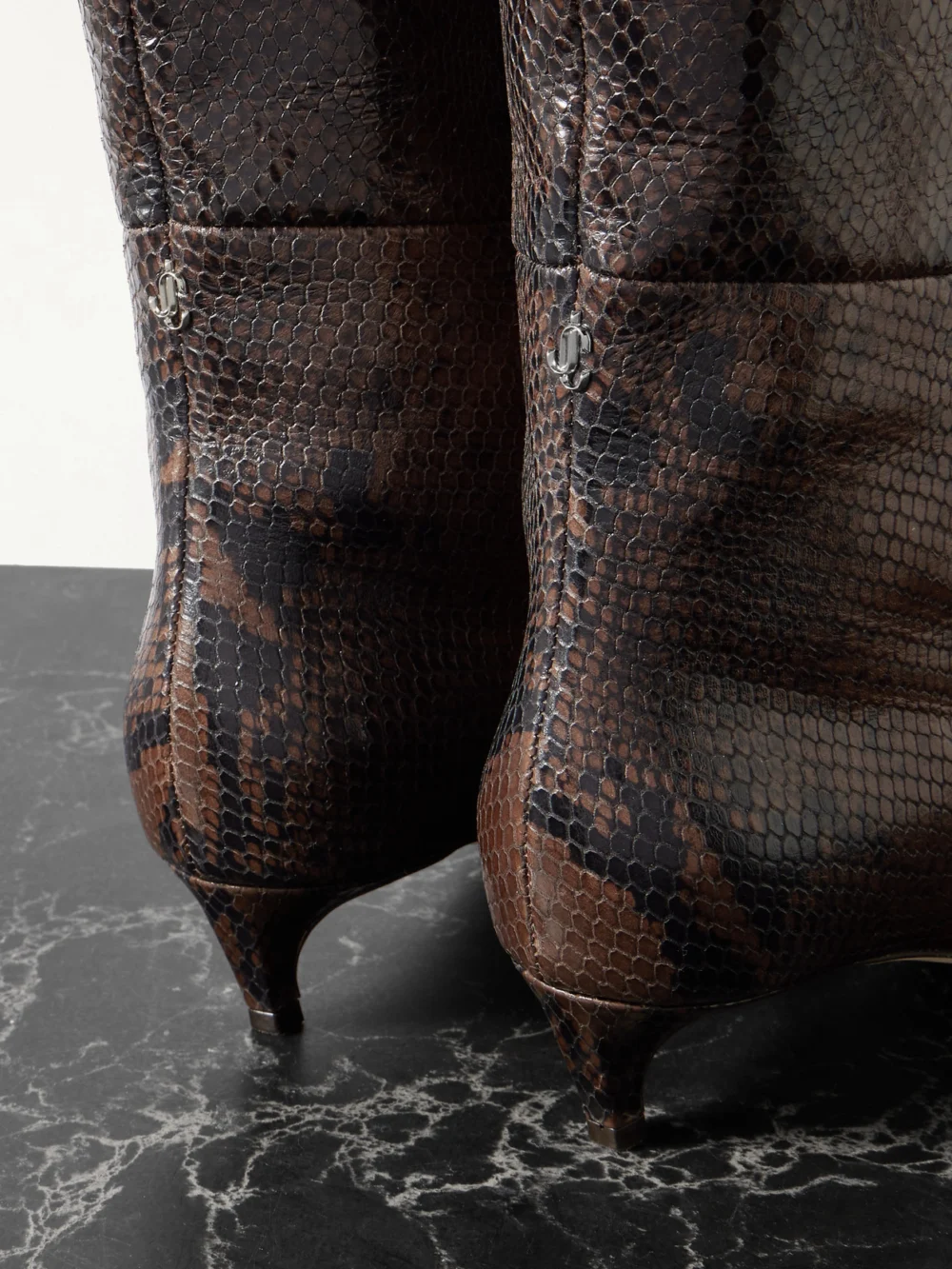 Close-up detail of the Jimmy Choo Maxima 35 Snake-effect Leather Knee Boots