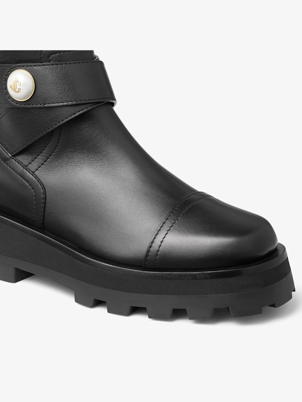 Close-up detail of the Jimmy Choo Meena Flat Black Leather Boots
