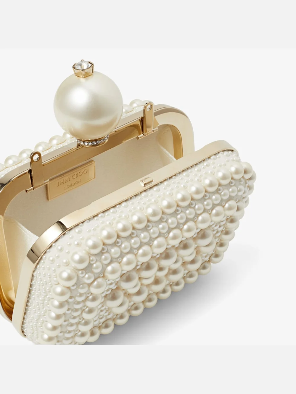 Side view of the Jimmy Choo Micro Cloud White Suede Clutch Bag with All Over Pearl Embellishment