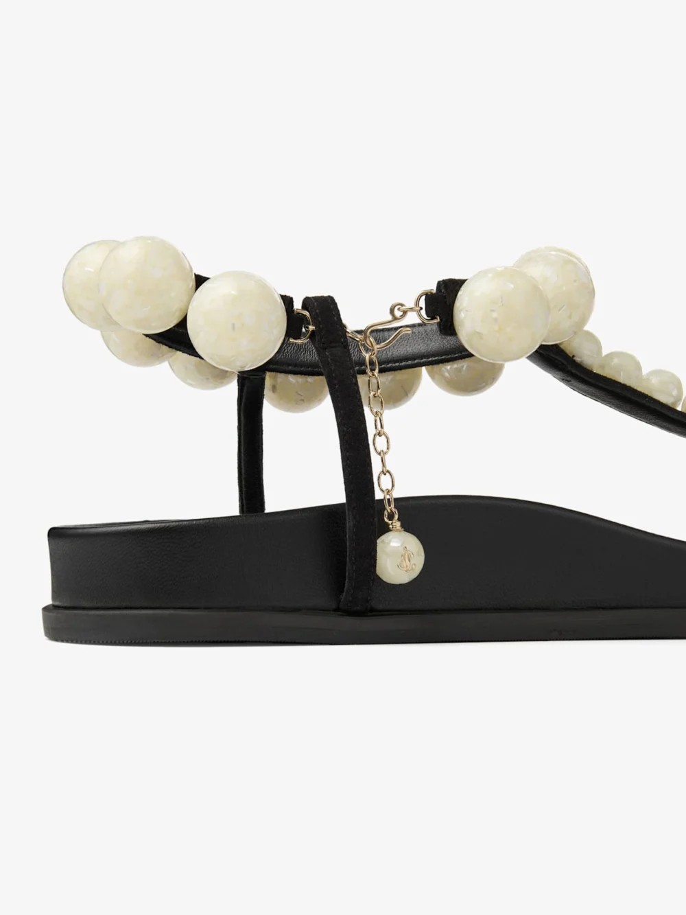 Back view of the Jimmy Choo Miro Flat Black Suede Sandals with Mother of Pearl Spheres