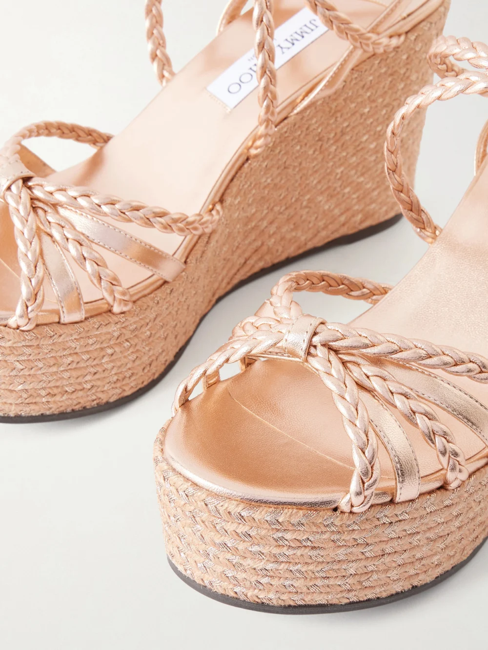 Close-up detail of the Jimmy Choo Nyra Metallic Leather Wedge Sandals