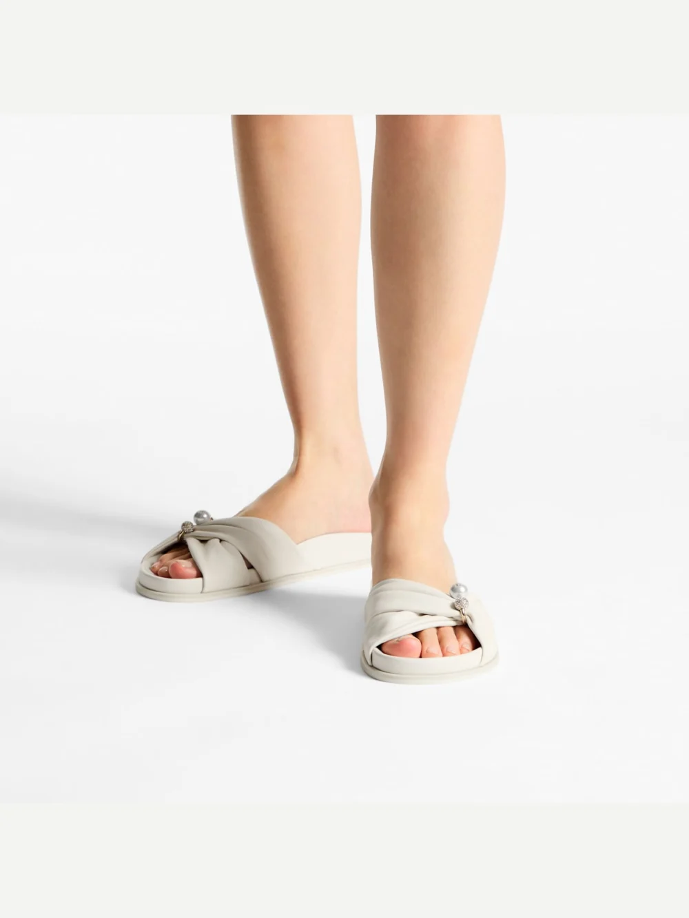 Side view of the Jimmy Choo Rafi Flat Latte Soft Glove Leather Flat Sandals