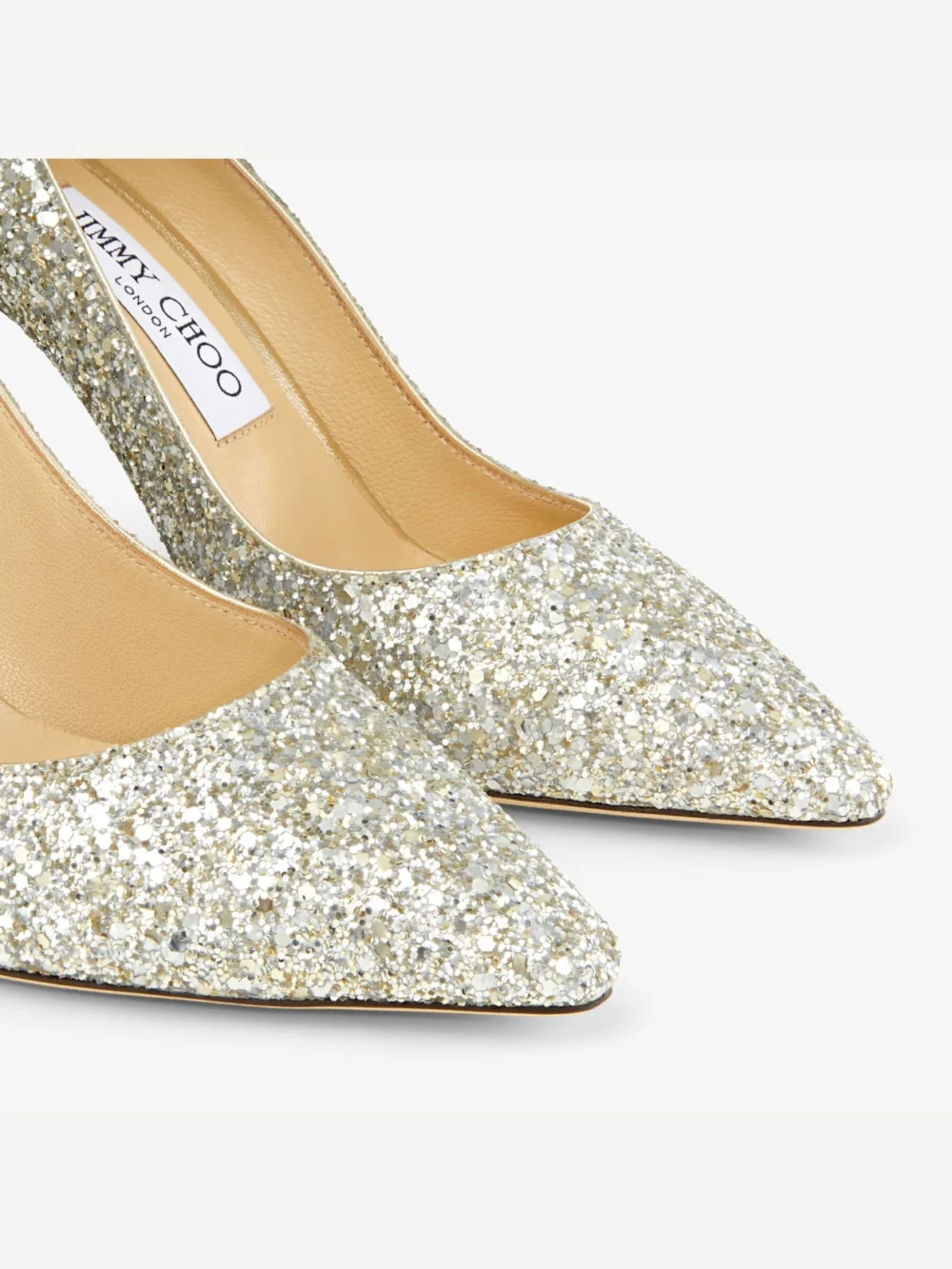 Close-up detail of the Jimmy Choo Romy 85 Champagne Coarse Glitter Fabric Pointy Toe Pumps