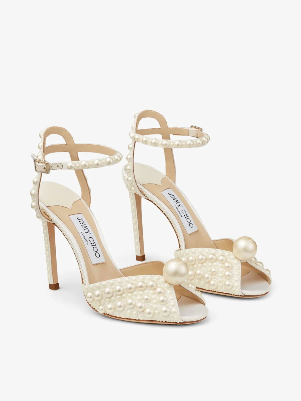 Side view of the Jimmy Choo Sacora 100 White Satin Sandals with All Over Pearls