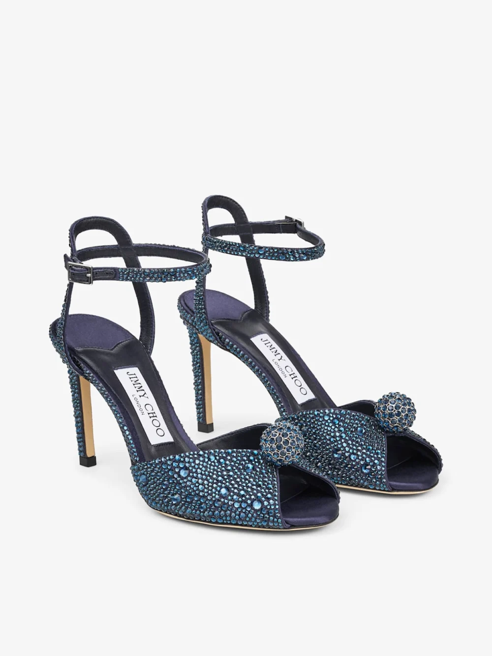Close-up detail of the Jimmy Choo Sacora 85 Marine Satin Sandals with Crystal Sphere
