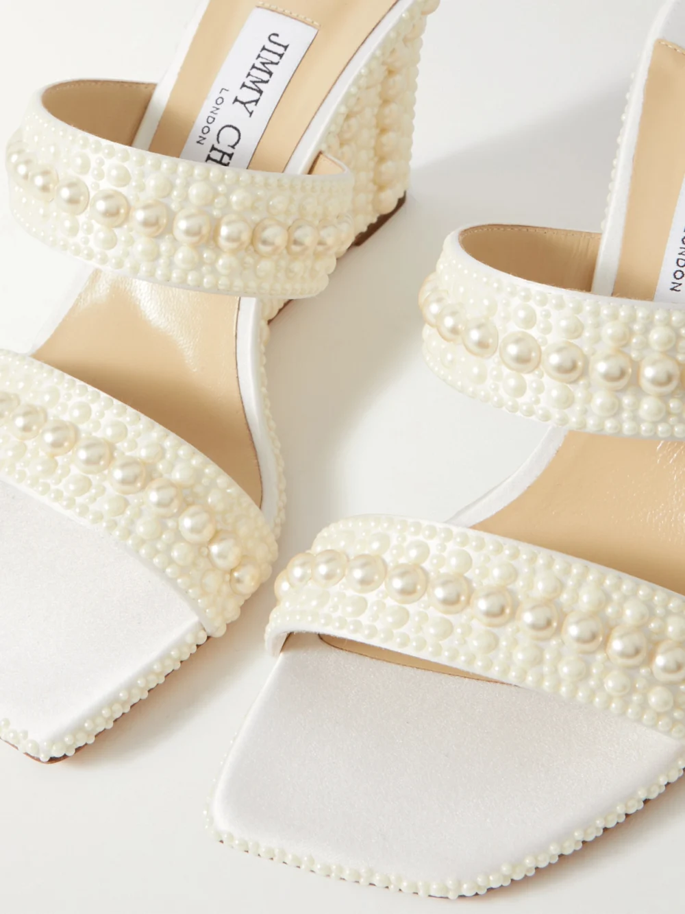 Close-up detail of the Jimmy Choo Sacoria 85 Pearl-embellished Satin Wedge Sandals