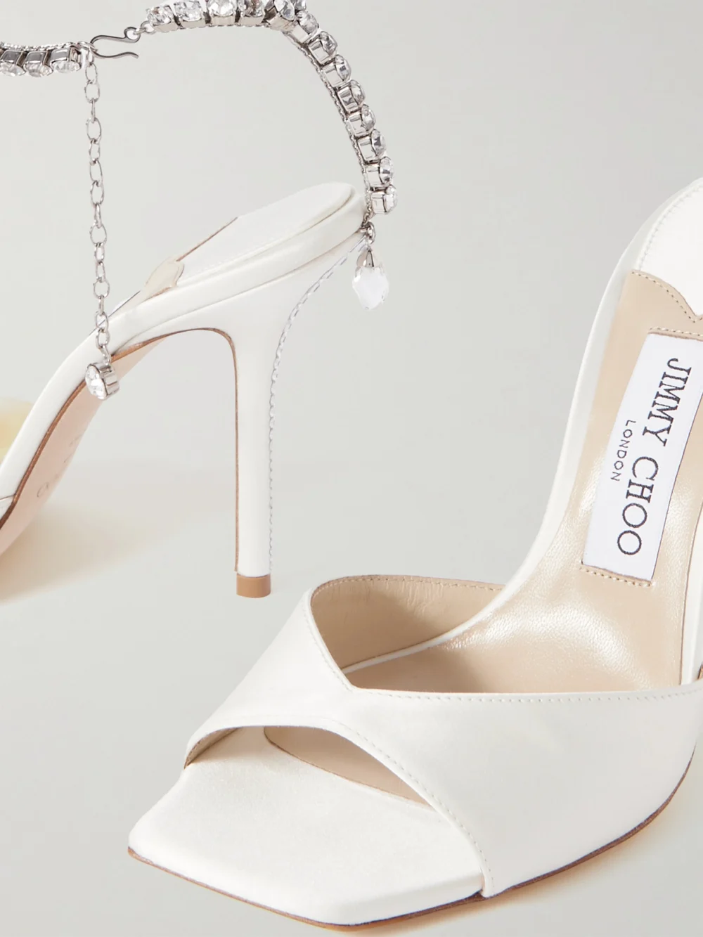 Close-up detail of the Jimmy Choo Saeda 100 Crystal-embellished Satin Sandals