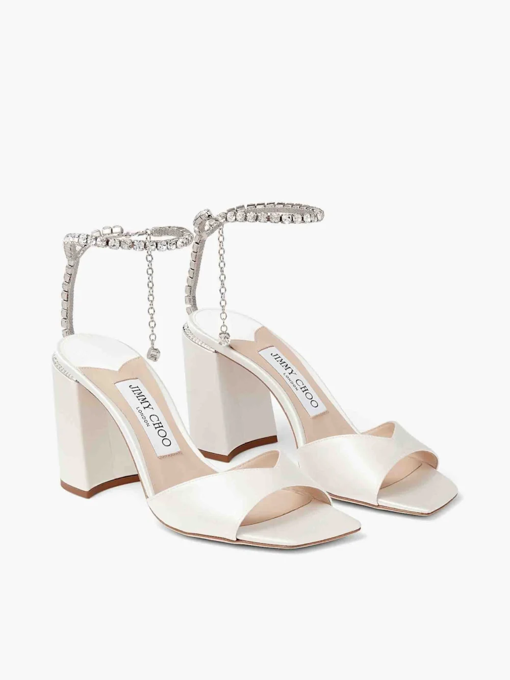 Side view of the Jimmy Choo Saeda Sandal Block Heel 85 Ivory Satin Block Heel Sandals with Crystal Chain