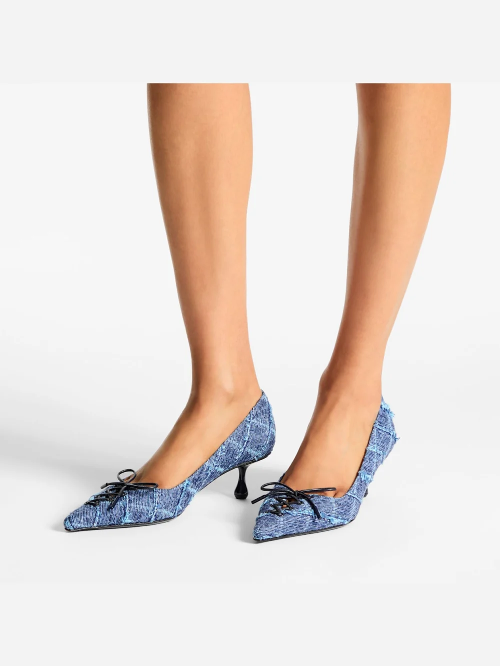 Side view of the Jimmy Choo Scarlett 50 Crosshatch Denim Pumps