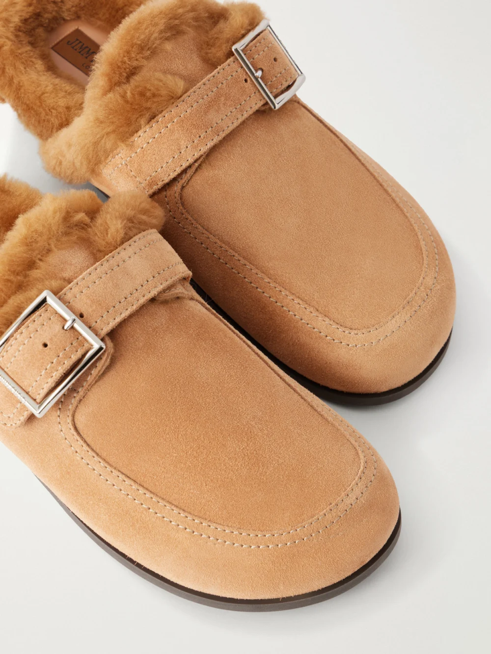 Close-up detail of the Jimmy Choo Shearling-trimmed Suede Mules