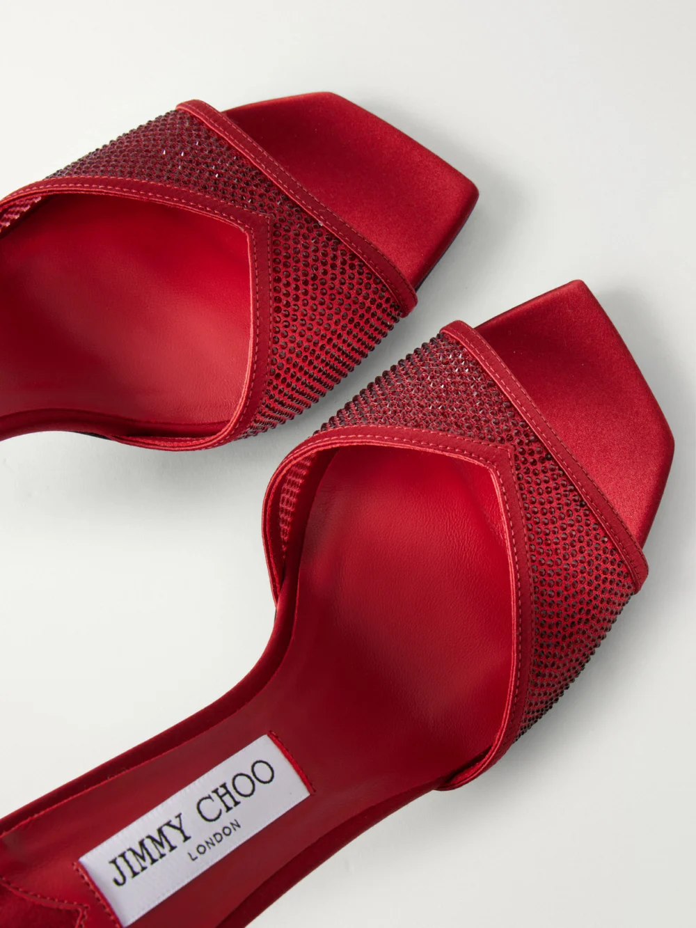 Close-up detail of the Jimmy Choo Skye 70 Crystal-embellished Satin-trimmed Mesh Mules