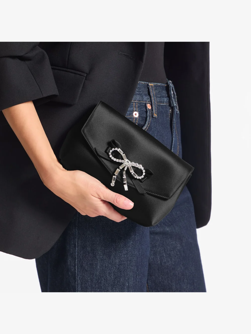 Side view of the Jimmy Choo Soft Bow Mini Bag Black Satin Mini Bag with Crystal Bow