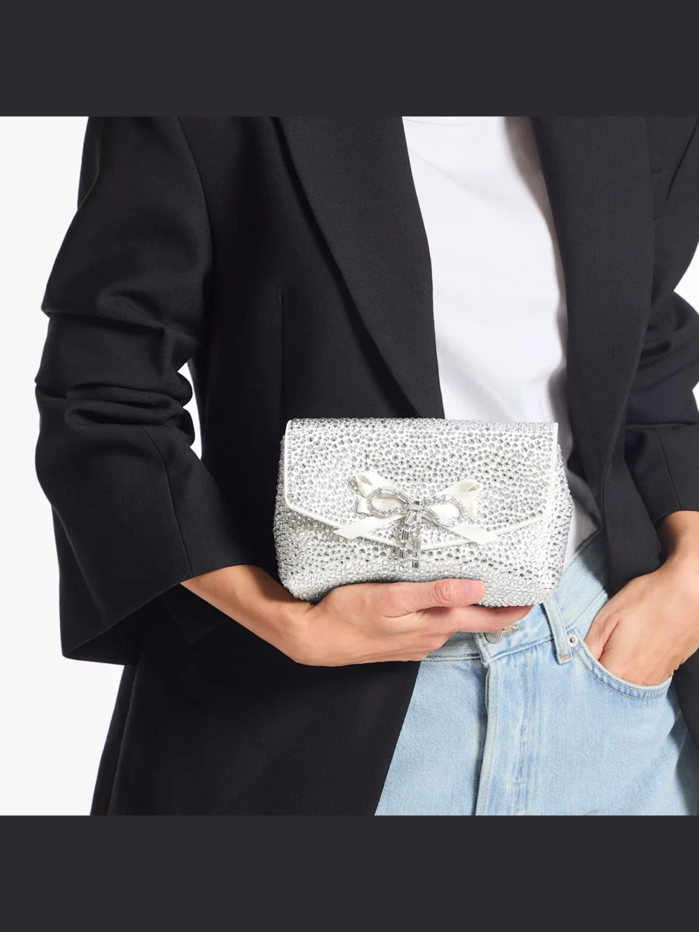 Side view of the Jimmy Choo Soft Bow Mini Bag Ivory Satin Mini Bag with Crystal Bow