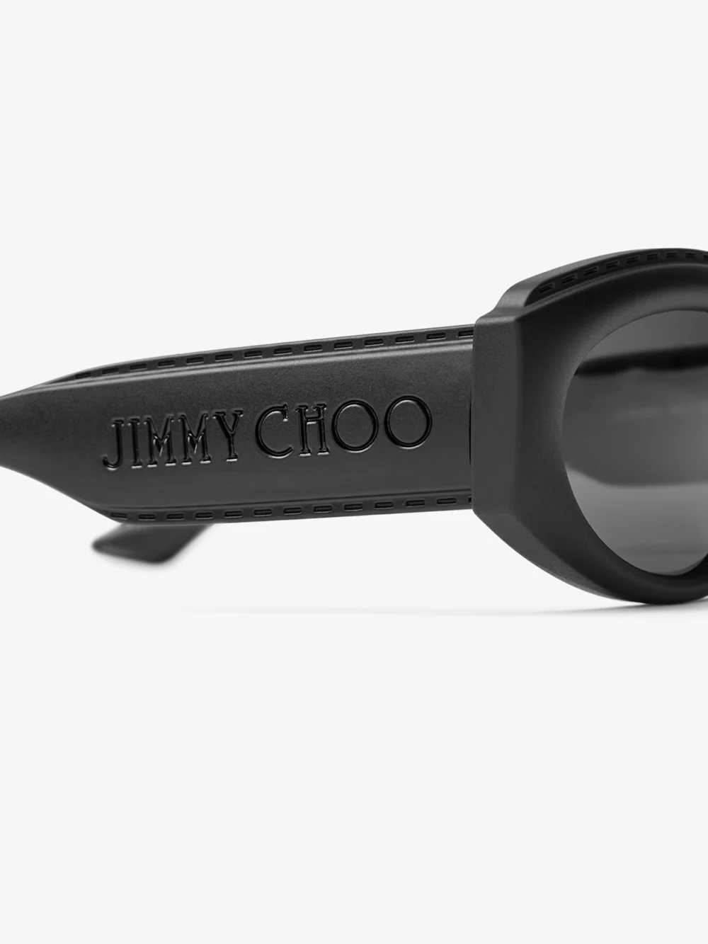 Close-up detail of the Jimmy Choo Sue Matte Black Oval Sunglasses